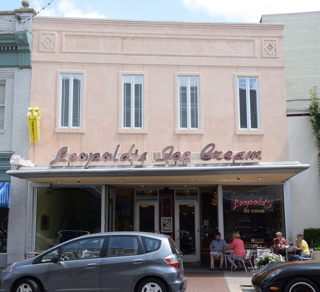 The pink facade and neon-lettered sign of Leopold's Ice Cream on Broughton Street in Savannah