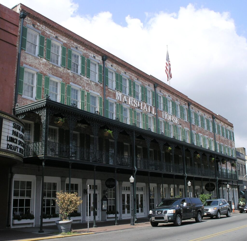 The long cast-iron balconies of the Marshall House hotel on Broughton Street in Savannah