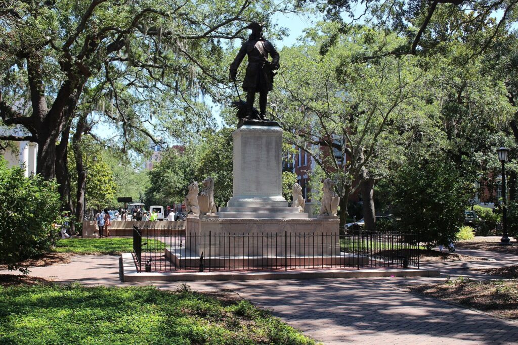 Savannah Georgia history: the bronze statue of James Oglethorpe on its tall pedestal in Chippewa Square, surrounded by live oaks