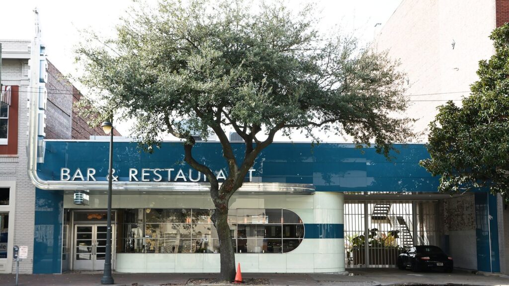 The streamlined blue and white former Greyhound terminal that houses The Grey, one of the best Savannah restaurants for first-time visitors