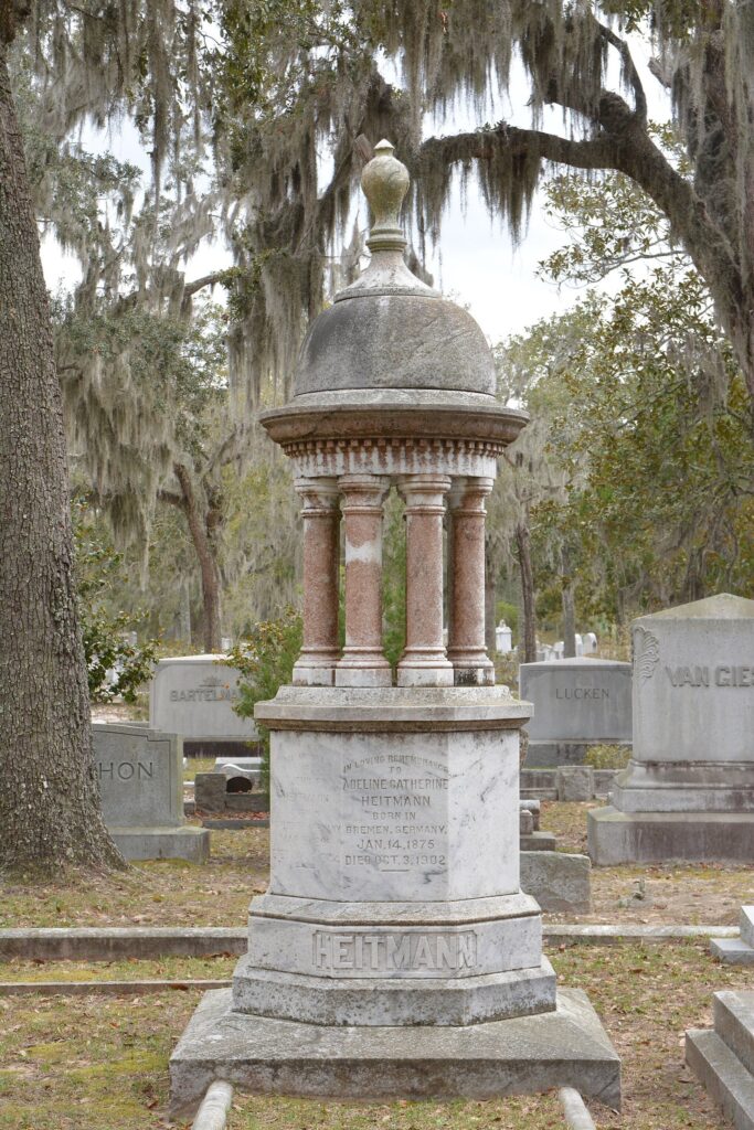 A domed Victorian monument under live oaks and Spanish moss in Bonaventure Cemetery, Savannah