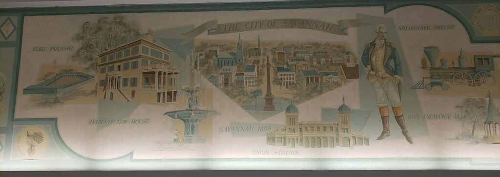A long painted mural of Savannah landmarks and history inside the city's Amtrak station