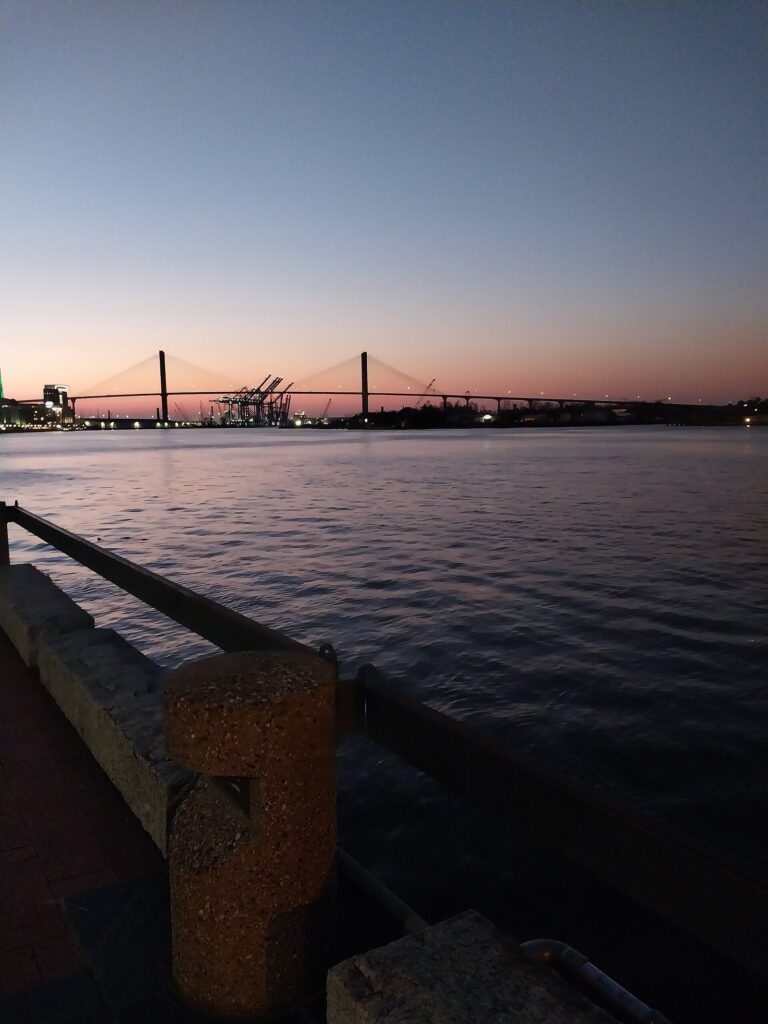 Sunset over the Savannah River with the Talmadge Memorial Bridge silhouetted in the distance