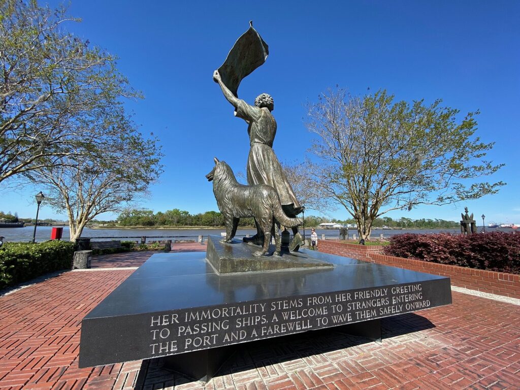 The bronze Waving Girl statue of Florence Martus with her collie, waving a cloth toward the Savannah River in Morrell Park